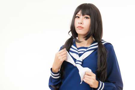 Asian playing cosplay in Japanese student uniformの写真素材