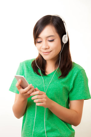 Young Asian woman with a audiophile Headphoneの写真素材