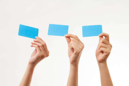 Blank card, people holding card that can be replace with everything you want, name card sign etc... shoot on isolated white backgroundの写真素材