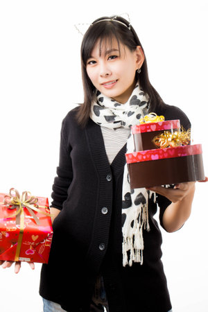 asian woman valentines day giving and receiving giftの写真素材