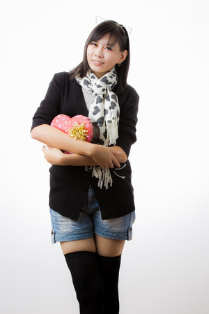 asian woman valentines day giving and receiving giftの写真素材