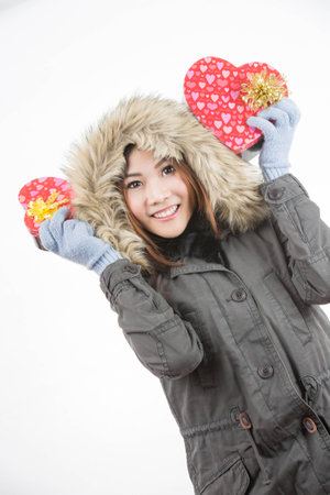 asian woman valentines day giving and receiving giftの写真素材