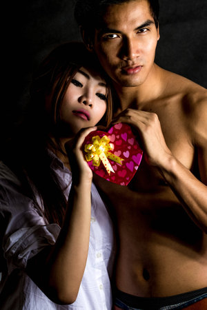 happy young couple shooting in studioの写真素材