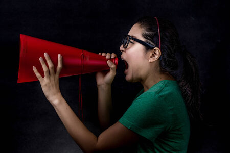 asian woman yelling shooting in studioの写真素材