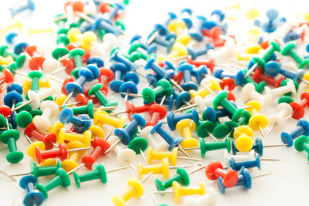 Colorful pins shooting in whiteの写真素材