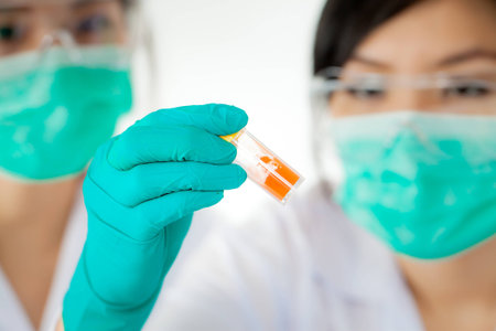 asian Researcher working with chemicals