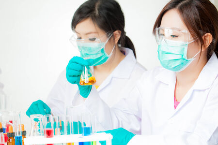asian Researcher working with chemicals