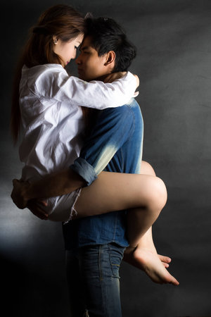 happy young couple shooting in studioの写真素材