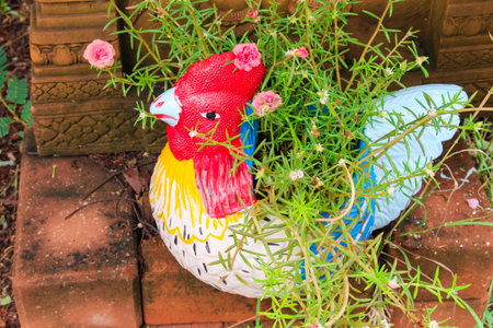 Plant in statue of a chicken.の写真素材