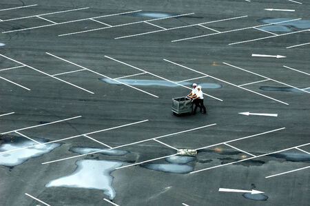 male and femaleworkers with cartの写真素材