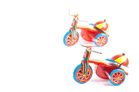 antique tin toy  tricycle on white background