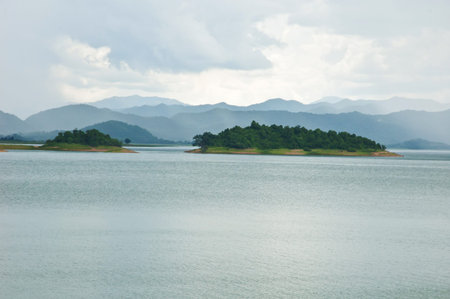 Mountain lake under cloudy sky