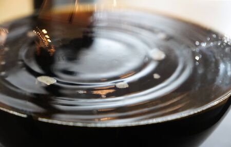 Image of coffee dripping in glass jarの写真素材