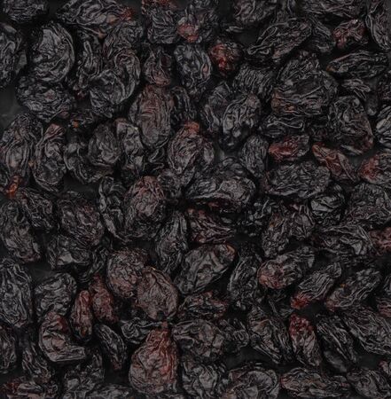 Organic black seedless raisins. For texture or background.の写真素材