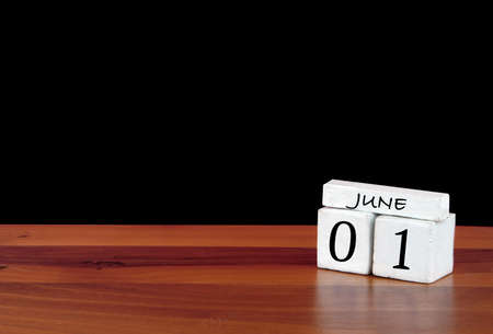 1 June calendar month. 1 days of the month. Reflected calendar on wooden floor with black backgroundの写真素材
