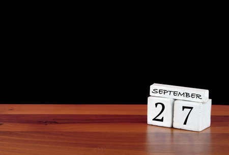 27 September calendar month. 27 days of the month. Reflected calendar on wooden floor with black backgroundの写真素材