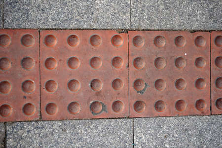 Visually impaired sign located on the groundの写真素材