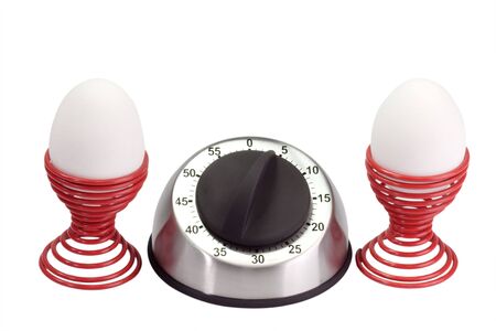 Egg timer with twoh eggs in eggcups - isolated on white backgroundの写真素材