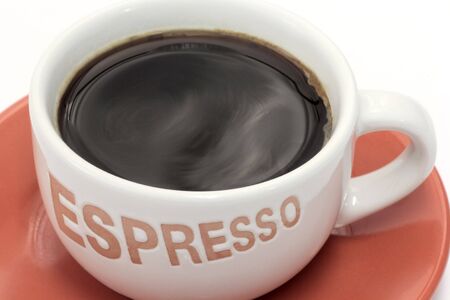 Close-up of a cup of espresso over white backgroundの写真素材