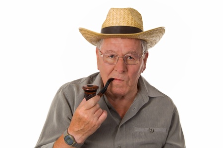 Old man with hat smoking a pipe - isolatedの写真素材