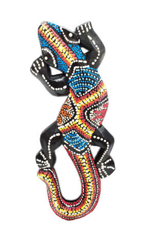 Painted wooden lizard - isolated on white backgroundの写真素材