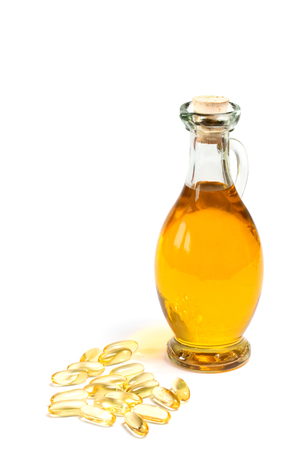 glass bottle of oil with vitamin capsulesの写真素材