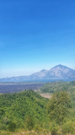 A captivating glimpse of a remote mountain peak in the distance, a testament to nature's grandeur and remote beautyの写真素材