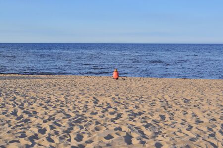 lonely figure on the beachの写真素材