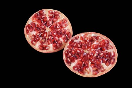 pomegranate cut on black bacgroundの写真素材