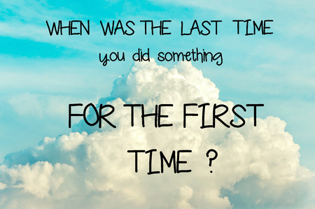 When was the last time you did something for the first time? Inspirational motivating quote on soft cloudy blue sky background. Vibrant multicolored outdoors horizontal imageの写真素材