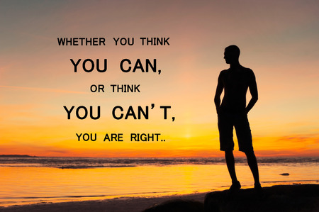 Whether you think you can or you think you can't you're right. Inspirational motivating quote with man silhouette standing on sunset background. Multicolored outdoors horizontal image. Copy space.の写真素材