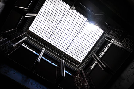 A blue cloudy sky  Roof skylight window, beautiful sunlightの写真素材