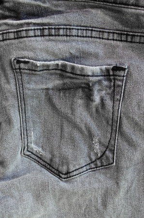 A pocket on on the back side of simple grey jeansの写真素材