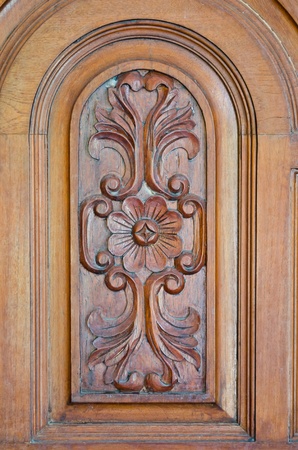 A part of a classic door carved as a flower and some leavesの写真素材