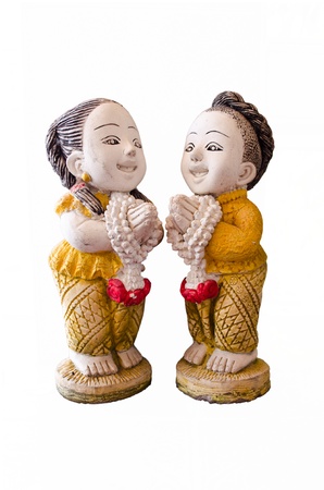 Two Thai dolls (a boy and a girl) made from ceramic in the act of Thai greetingの写真素材