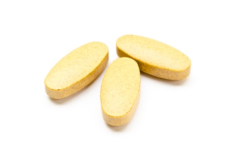 Three tablets of vitamin C with the white backgroundの写真素材