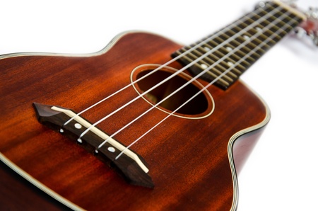Isolated close-up of brown wooden ukuleleの写真素材