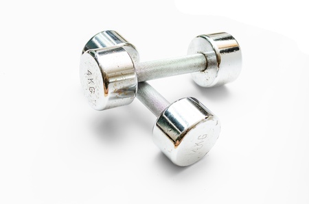 a couple of 4kg metal dumbbells lying on mutually の写真素材