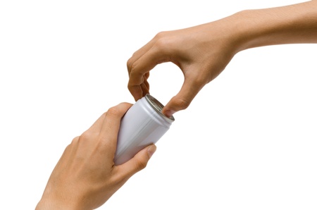 hands try to open a white canの写真素材