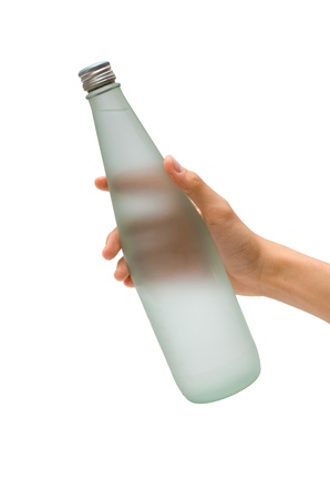 A hand holding a bottle of mineral waterの写真素材