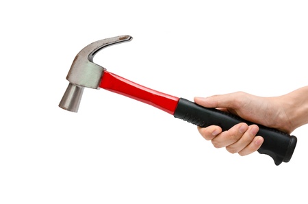 a hand using a red hammer on the white backgroundの写真素材