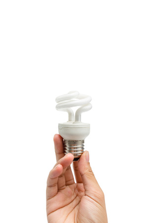 a hand holding a lightbulbの写真素材