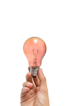 a hand holding a red-orange lightbulbの写真素材
