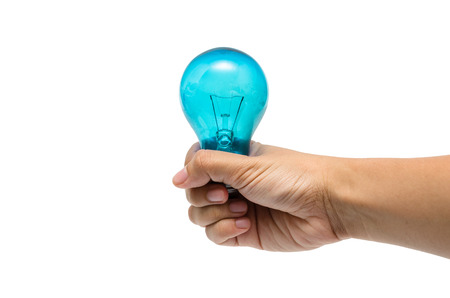 a hand holding a light-blue lightbulbの写真素材