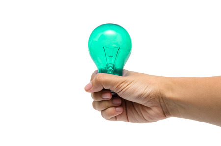 a hand holding a blue-green lightbulbの写真素材