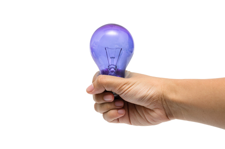 a hand holding a purple lightbulbの写真素材