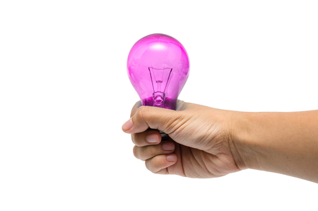 a hand holding a pink lightbulbの写真素材