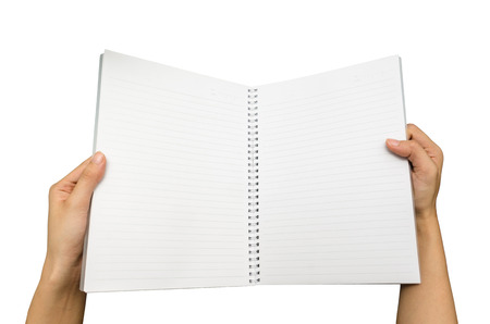 hands opening a blank opened notebook on the white backgroundの写真素材