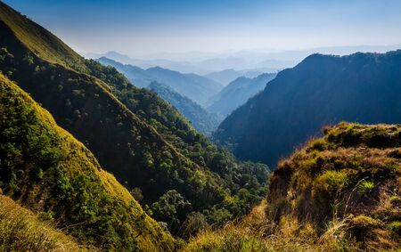 yellow, green and blue mountains in a sunny dayの写真素材