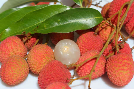 Lychees in my garden. Focus on peeled one.